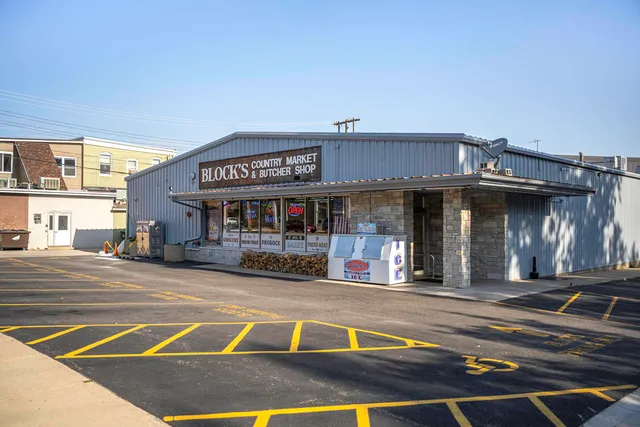 a view of a food mall next to a road