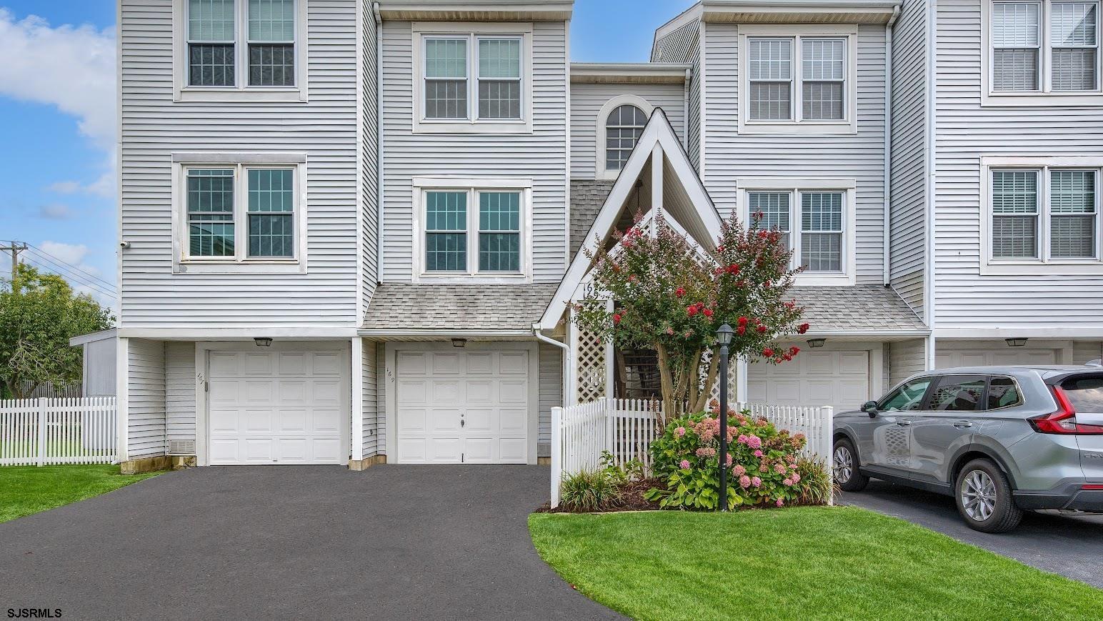 167 40th Street South, Unit 2 Brigantine, NJ 08203 - Photo 2 of 28 a house view with a garden space