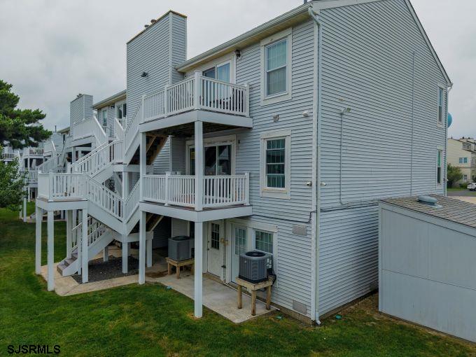 167 40th Street South, Unit 2 Brigantine, NJ 08203 - Photo 27 of 28 a view of a house with a yard and sitting area