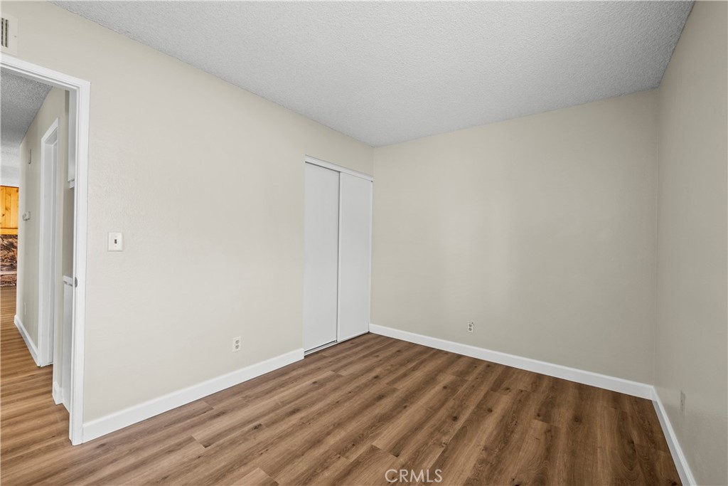 30008 Abelia Road Canyon Country, CA 91387 - Photo 20 of 32 a view of room with wooden floor