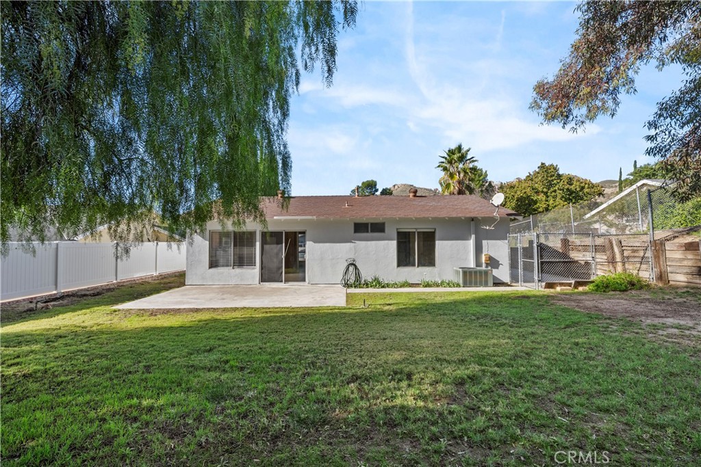 30008 Abelia Road Canyon Country, CA 91387 - Photo 24 of 32 a front view of a house with a garden