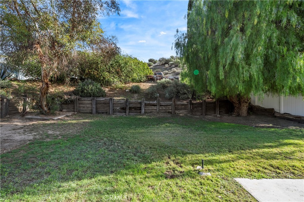 30008 Abelia Road Canyon Country, CA 91387 - Photo 28 of 32 a backyard of a house with lots of green space