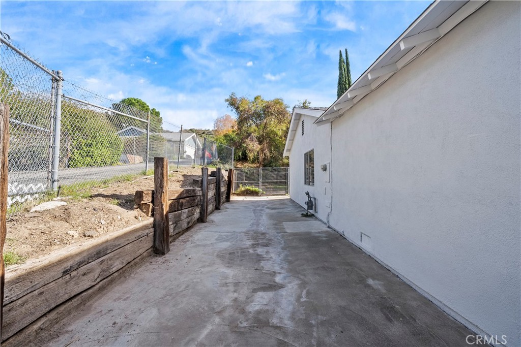 30008 Abelia Road Canyon Country, CA 91387 - Photo 29 of 32 a view of a porch with furniture and a gate