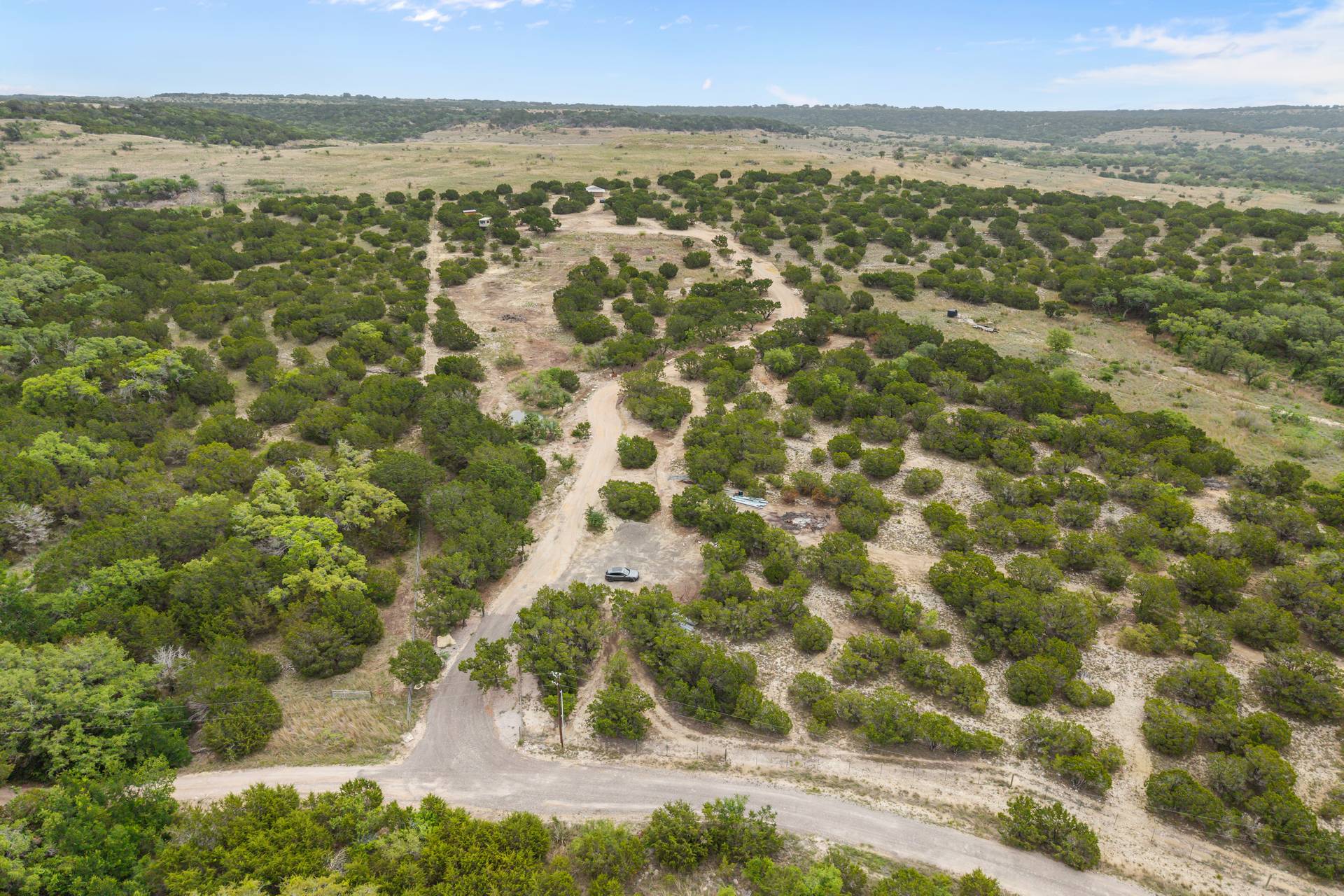 182 Quail Creek Road Marble Falls, TX 78654 - Photo 2 of 20 Aerial looking up from Quail Creek Rd. to the top of the property