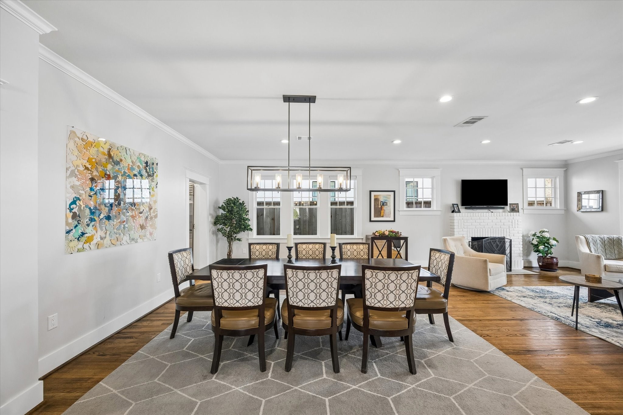 1307 Marshall Street Houston, TX 77006 - Photo 9 of 23 The dining room was opened up by the current owner and allows a natural flow from living to dining to bar.