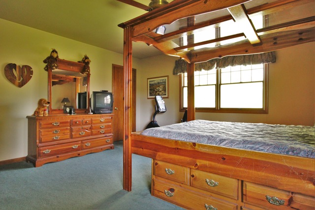 235 Grandin Road Morris, IL 60450 - Photo 11 of 20 a bedroom with a bed and a dresser