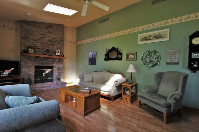 235 Grandin Road Morris, IL 60450 - Photo 8 of 20 a living room with furniture and a fireplace