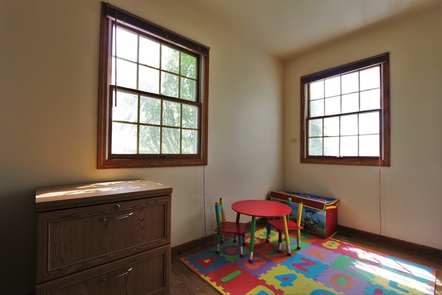235 Grandin Road Morris, IL 60450 - Photo 10 of 20 a living room with a piano and a window