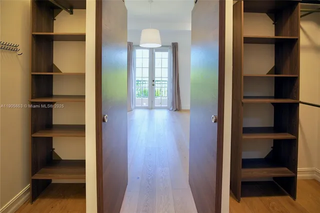a white tub sitting next to a toilet