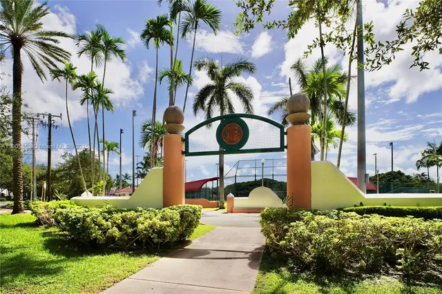 a view of a swimming pool in a backyard