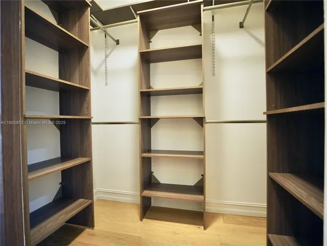 a hallway with wooden floor