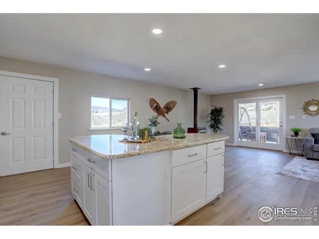 a kitchen with sink and cabinets