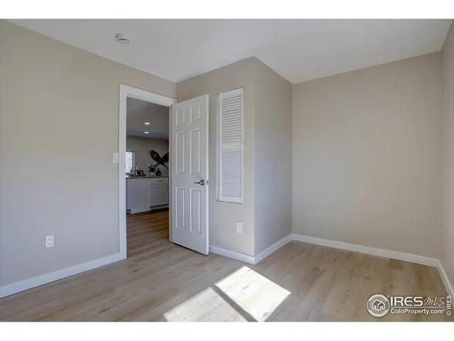 a view of a room with wooden walls