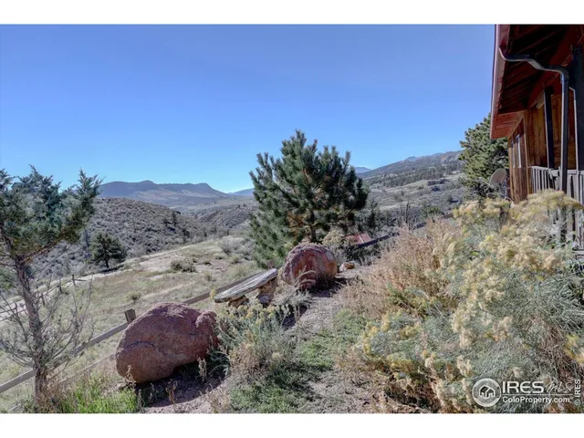 a aerial view of a house with mountain view