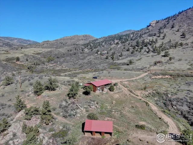 a view of a large mountain with mountains in the background