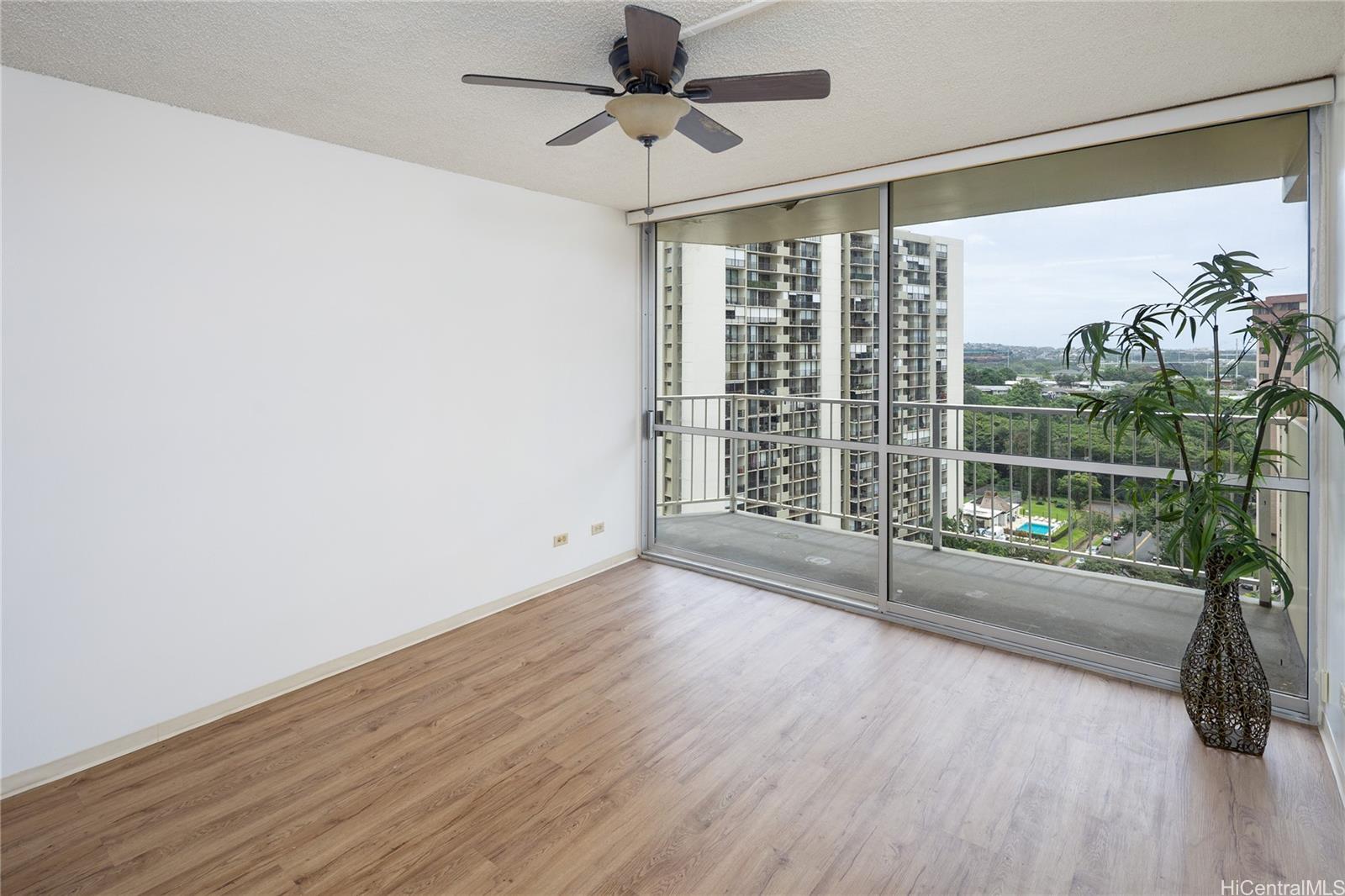a view of livingroom with furniture wooden floor and fan