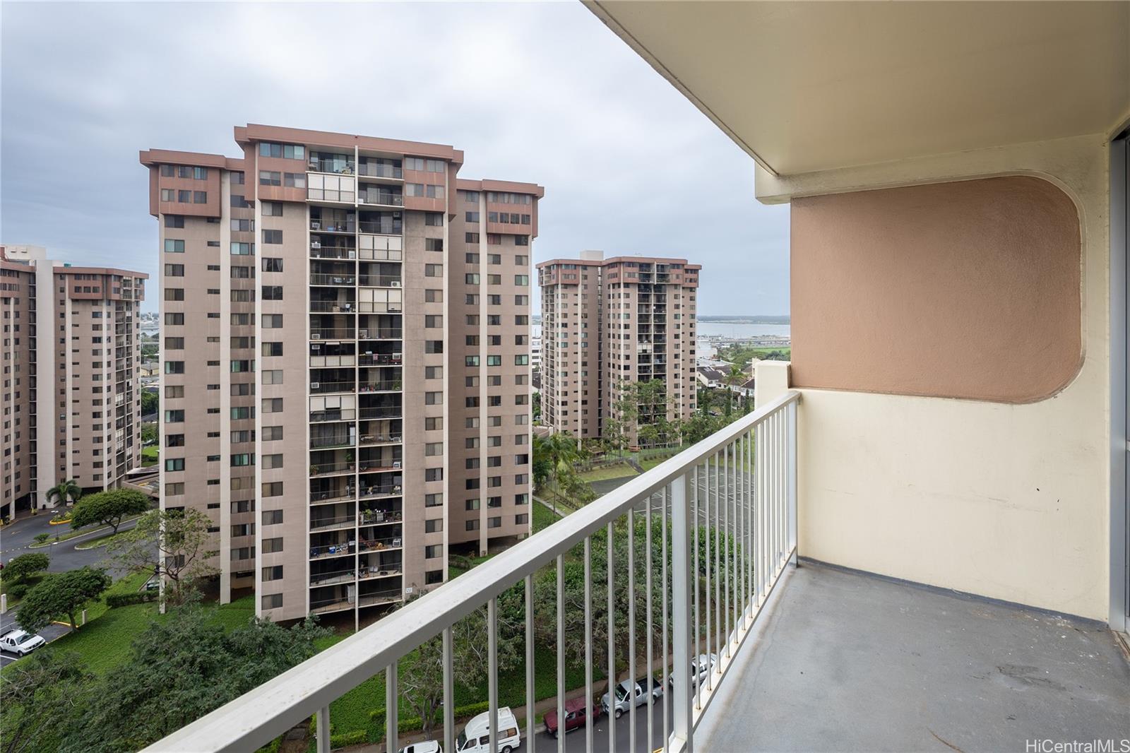 98-450 Koauka Loop, Unit 1108 Aiea, HI 96701 - Photo 20 of 22 a view of balcony with a floor to ceiling window and plants
