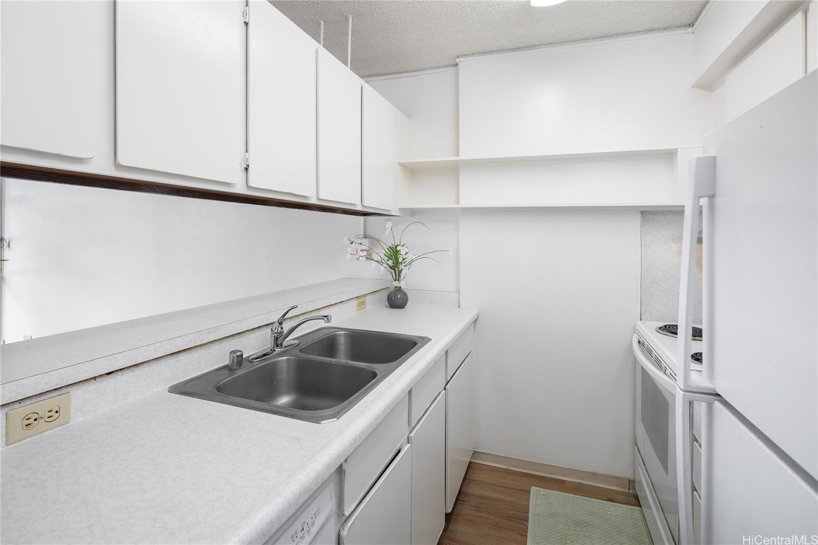 98-450 Koauka Loop, Unit 1108 Aiea, HI 96701 - Photo 6 of 22 a view white cabinets and a sink