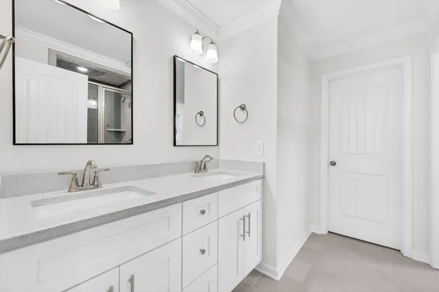 a bathroom with a glass shower door
