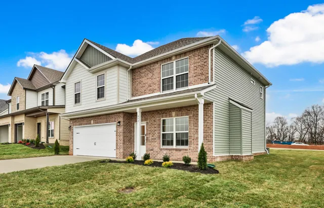 a front view of a house with a yard