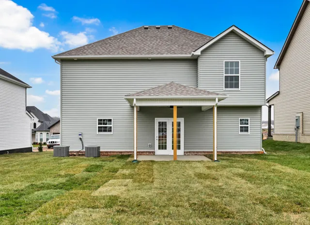 a front view of a house with a yard