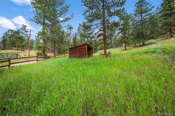 a backyard of a house with lots of green space