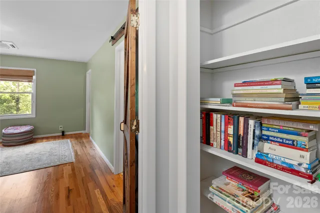 a view of front door with wooden floor