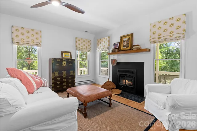 a living room with furniture a window and a fireplace