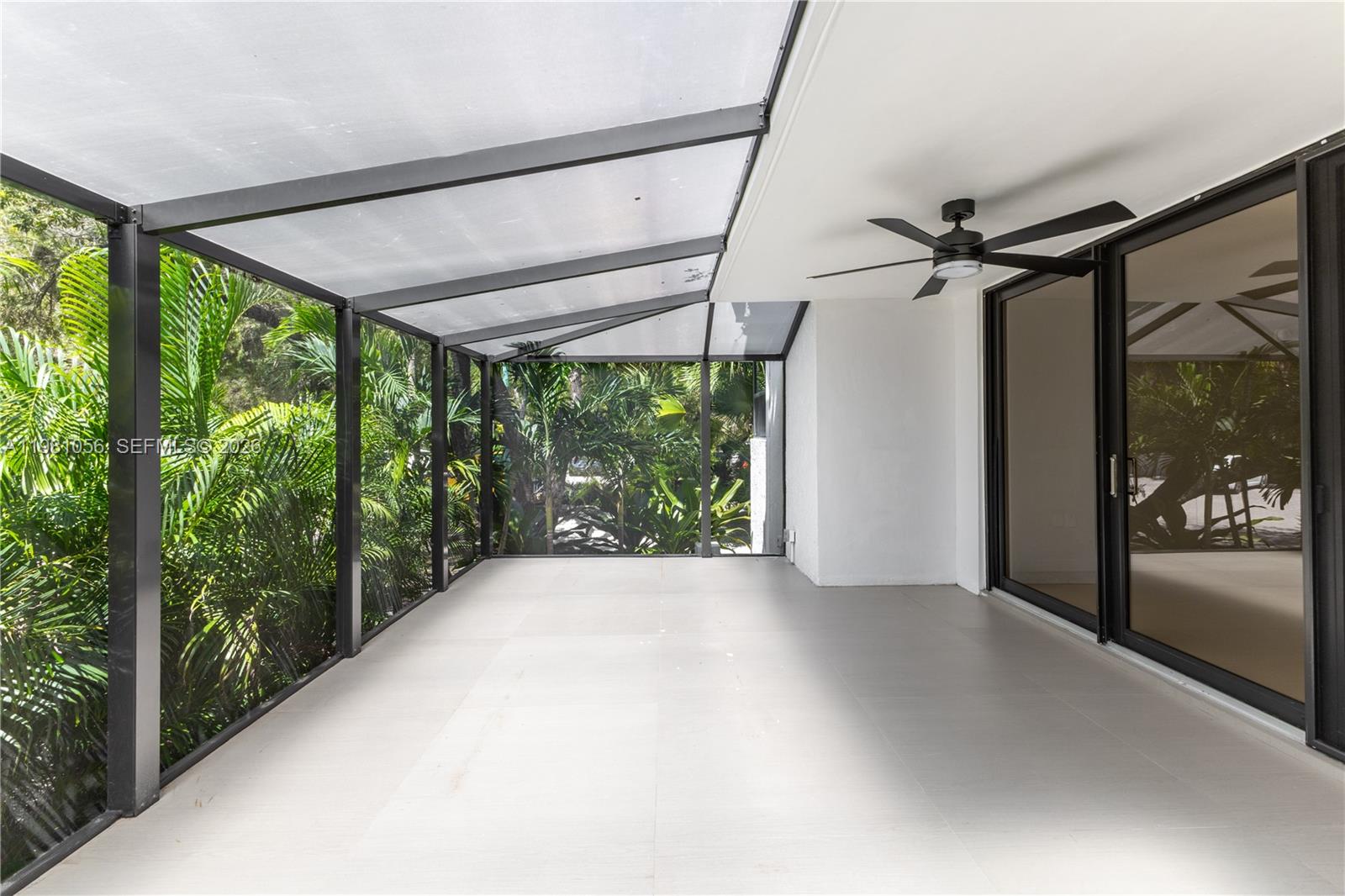 101 Ocean Ln Drive, Unit 1013 Key Biscayne, FL 33149 - Photo 15 of 28 a view of a glass door with a balcony