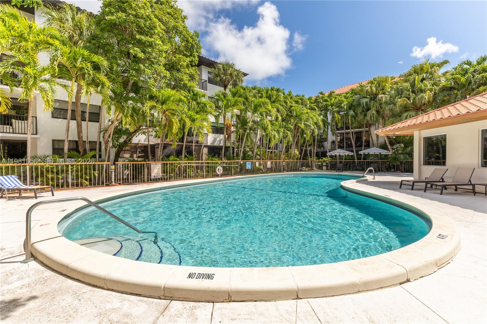 101 Ocean Ln Drive, Unit 1013 Key Biscayne, FL 33149 - Photo 17 of 28 a view of outdoor space yard deck patio and swimming pool
