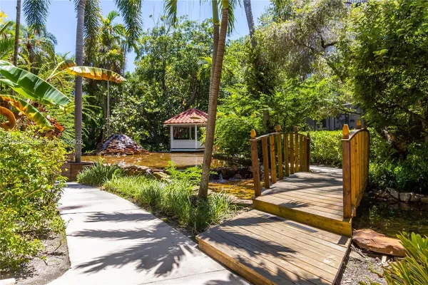 a view of a backyard with sitting area