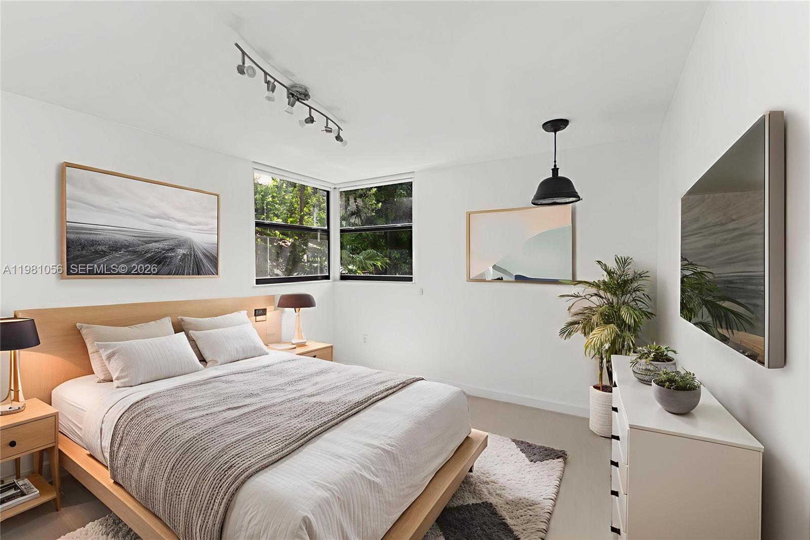 101 Ocean Ln Drive, Unit 1013 Key Biscayne, FL 33149 - Photo 7 of 28 a bedroom with a bed and a potted plant