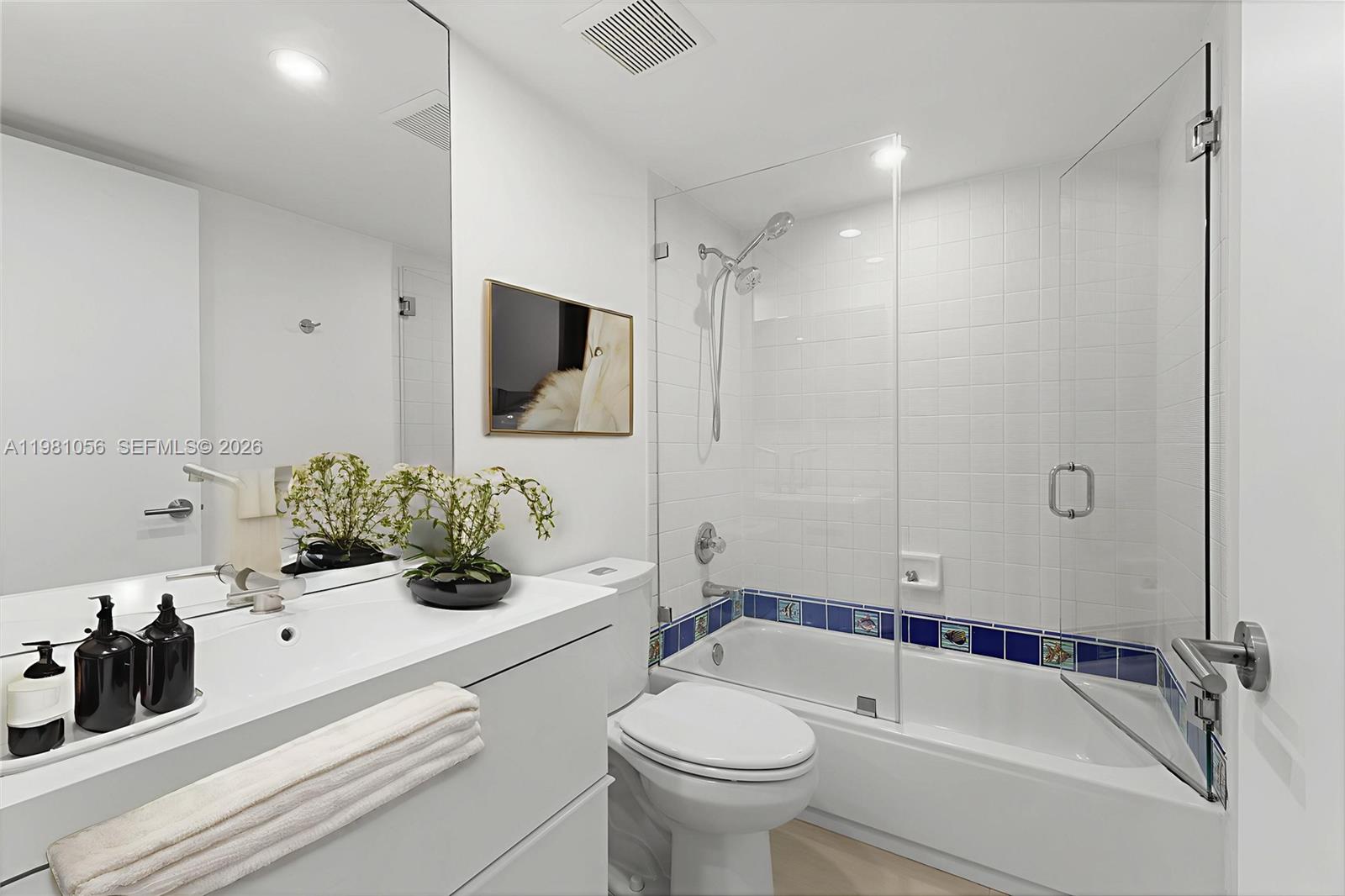 101 Ocean Ln Drive, Unit 1013 Key Biscayne, FL 33149 - Photo 8 of 28 a bathroom with a sink a toilet and a bathtub