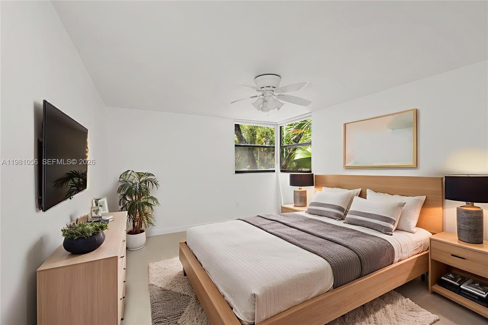 101 Ocean Ln Drive, Unit 1013 Key Biscayne, FL 33149 - Photo 9 of 28 a bedroom with a bed and a flat screen tv