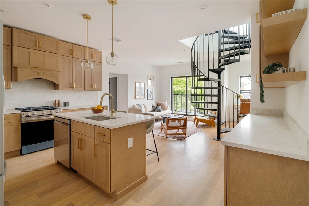 95 Addison Street, Unit PH7 Boston, MA 02128 - Photo 3 of 17 a kitchen with a stove and a sink