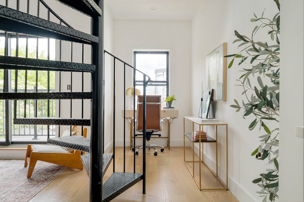 95 Addison Street, Unit PH7 Boston, MA 02128 - Photo 8 of 17 a view of an entryway with a staircase