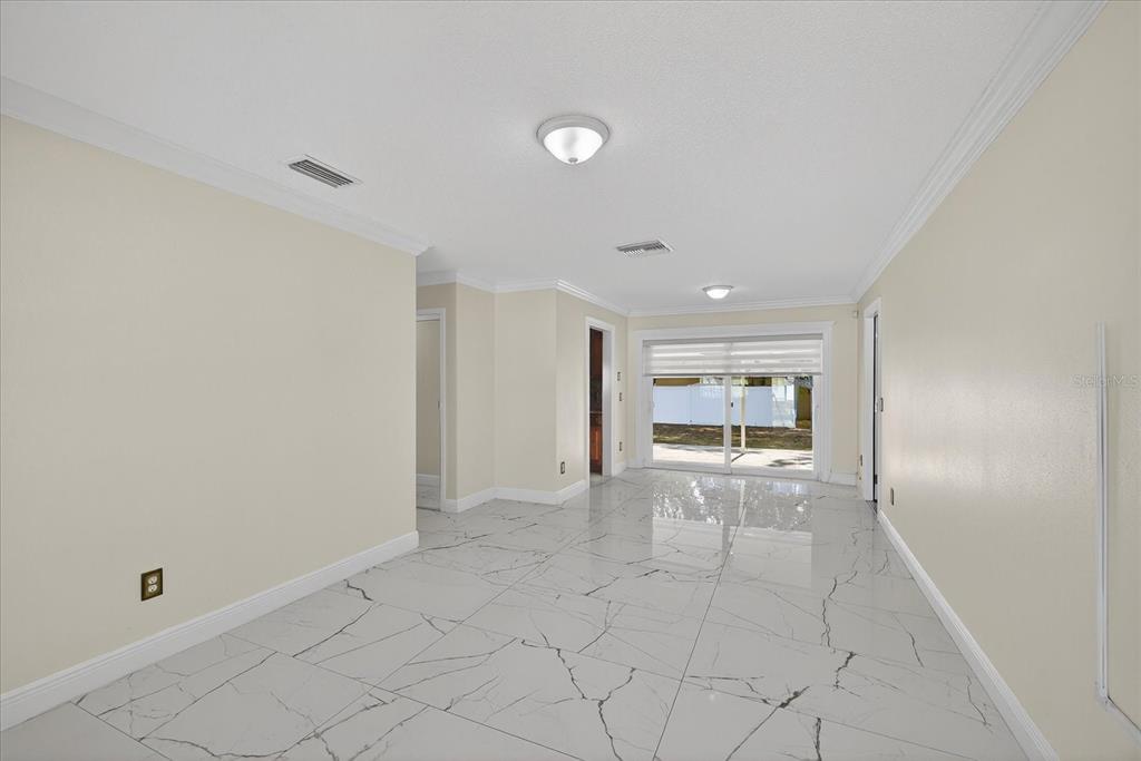 2015 Balfour Circle Tampa, FL 33619 - Photo 14 of 42 a view of an empty room with a window
