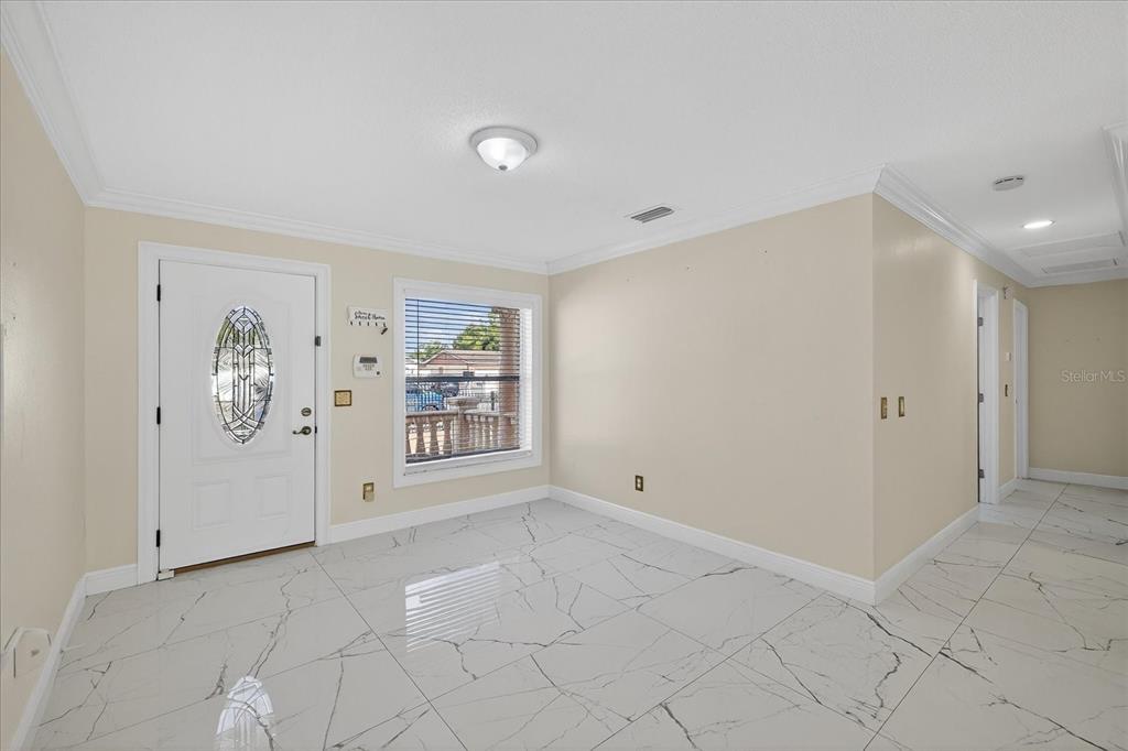 2015 Balfour Circle Tampa, FL 33619 - Photo 17 of 42 a view of an empty room with a window