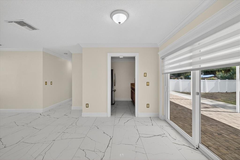 2015 Balfour Circle Tampa, FL 33619 - Photo 18 of 42 a view of an empty room with glass door