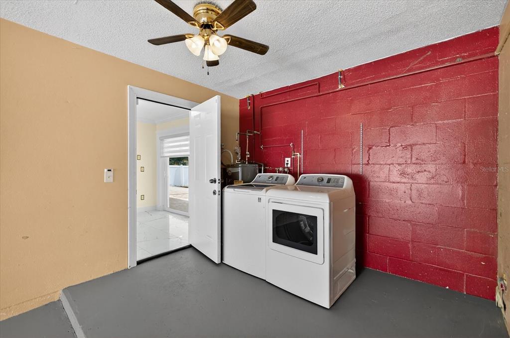 2015 Balfour Circle Tampa, FL 33619 - Photo 32 of 42 a utility room with dryer and washer