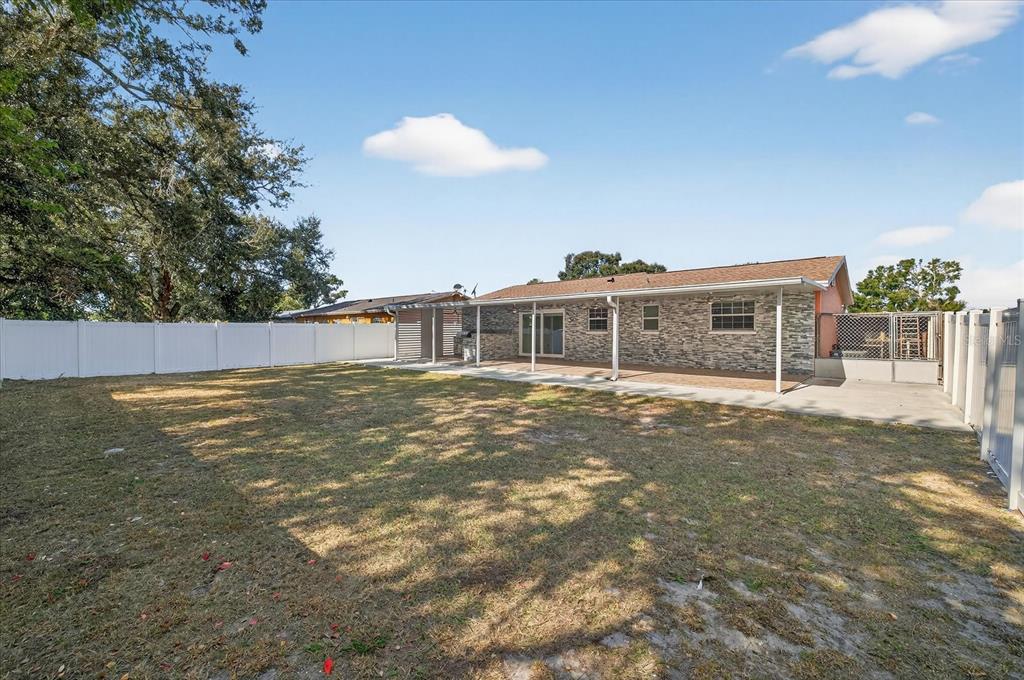 2015 Balfour Circle Tampa, FL 33619 - Photo 39 of 42 a view of a house with a backyard and a window