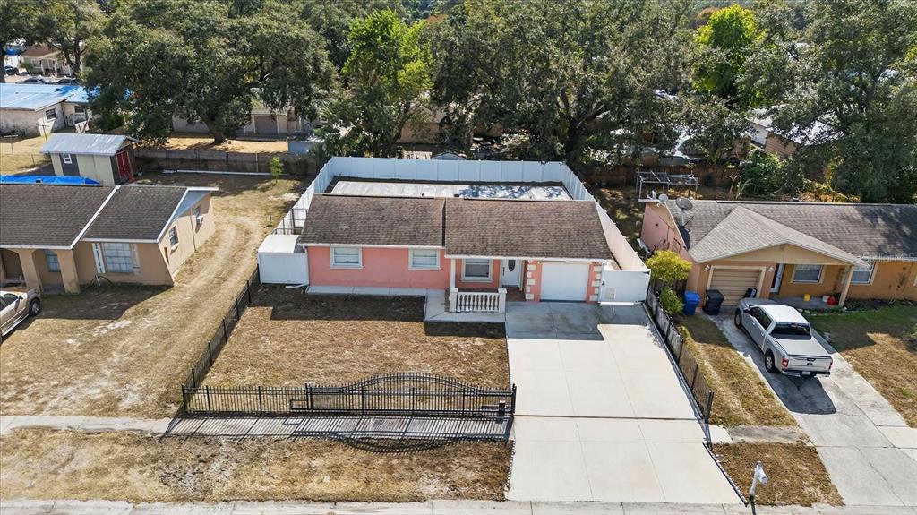 2015 Balfour Circle Tampa, FL 33619 - Photo 4 of 42 an aerial view of a house with swimming pool