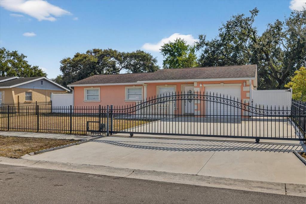 2015 Balfour Circle Tampa, FL 33619 - Photo 10 of 42 a view of a house with a iron gate