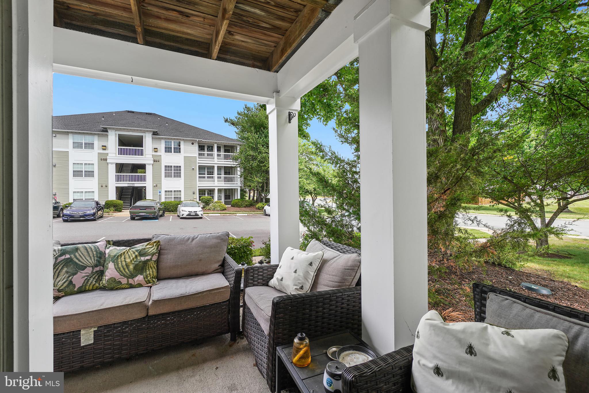 14151 Cuddy Loop, Unit 101 Woodbridge, VA 22193 - Photo 26 of 45 a outdoor living space with furniture and garden view