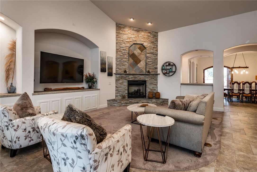 10023 Dike Road Mohave Valley, AZ 86440 - Photo 12 of 100 a living room with furniture a flat screen tv and a fireplace