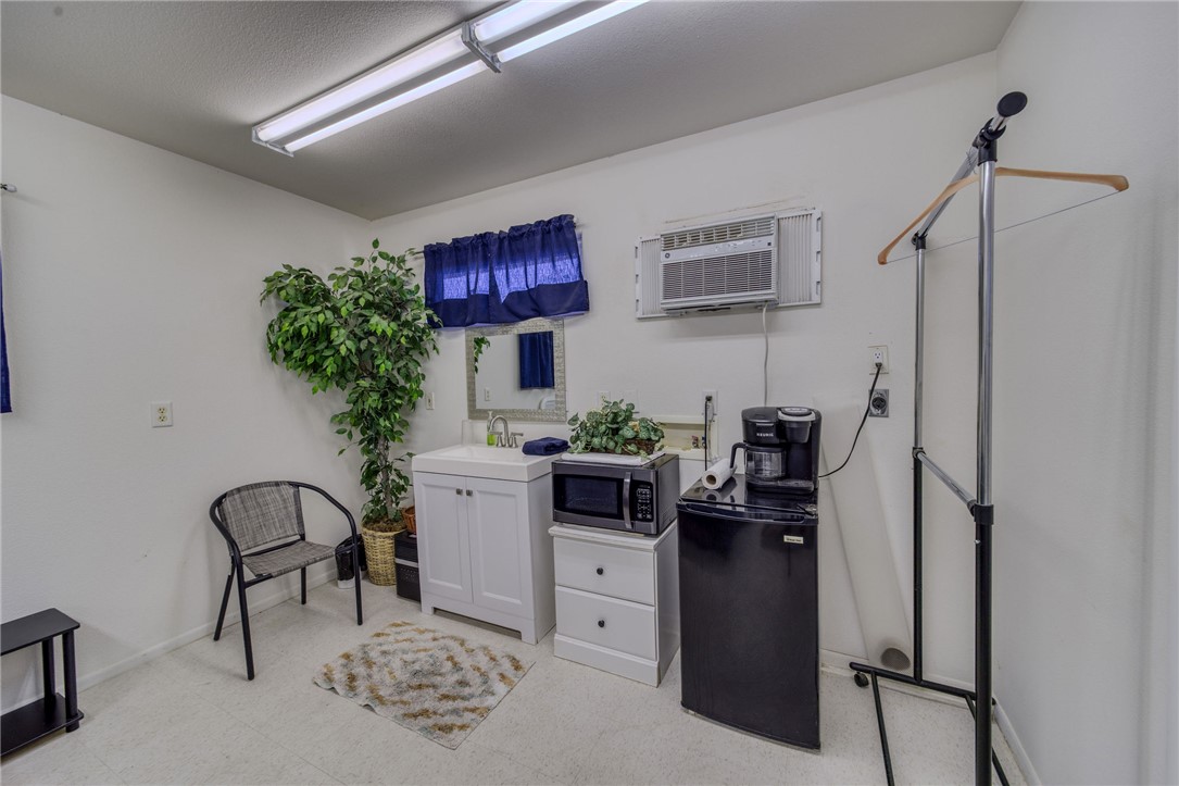 10023 Dike Road Mohave Valley, AZ 86440 - Photo 78 of 100 a view of a workspace with furniture and a potted plant