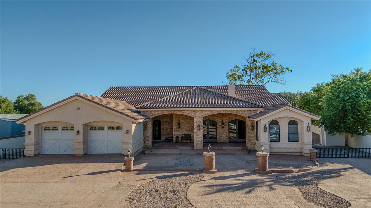 10023 Dike Road Mohave Valley, AZ 86440 - Photo 89 of 100 a front view of a house with garden