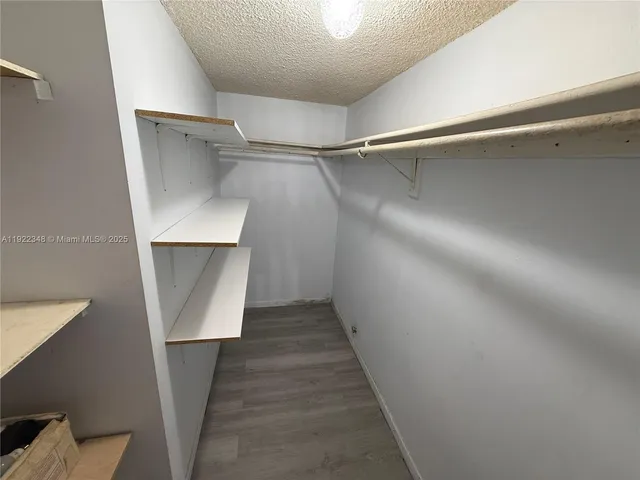 a view of staircase with wooden floor