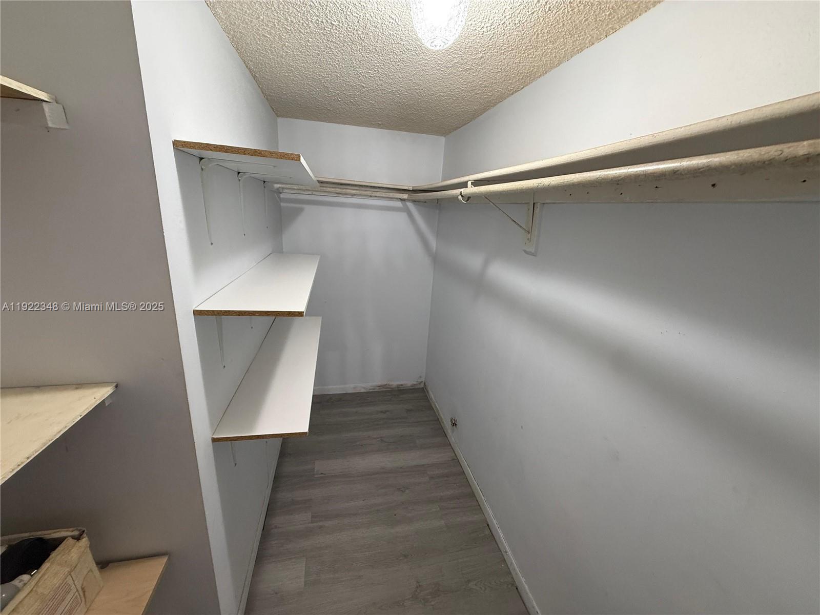 7355 West 4th Avenue, Unit 214 Hialeah, FL 33014 - Photo 11 of 15 a view of staircase with wooden floor