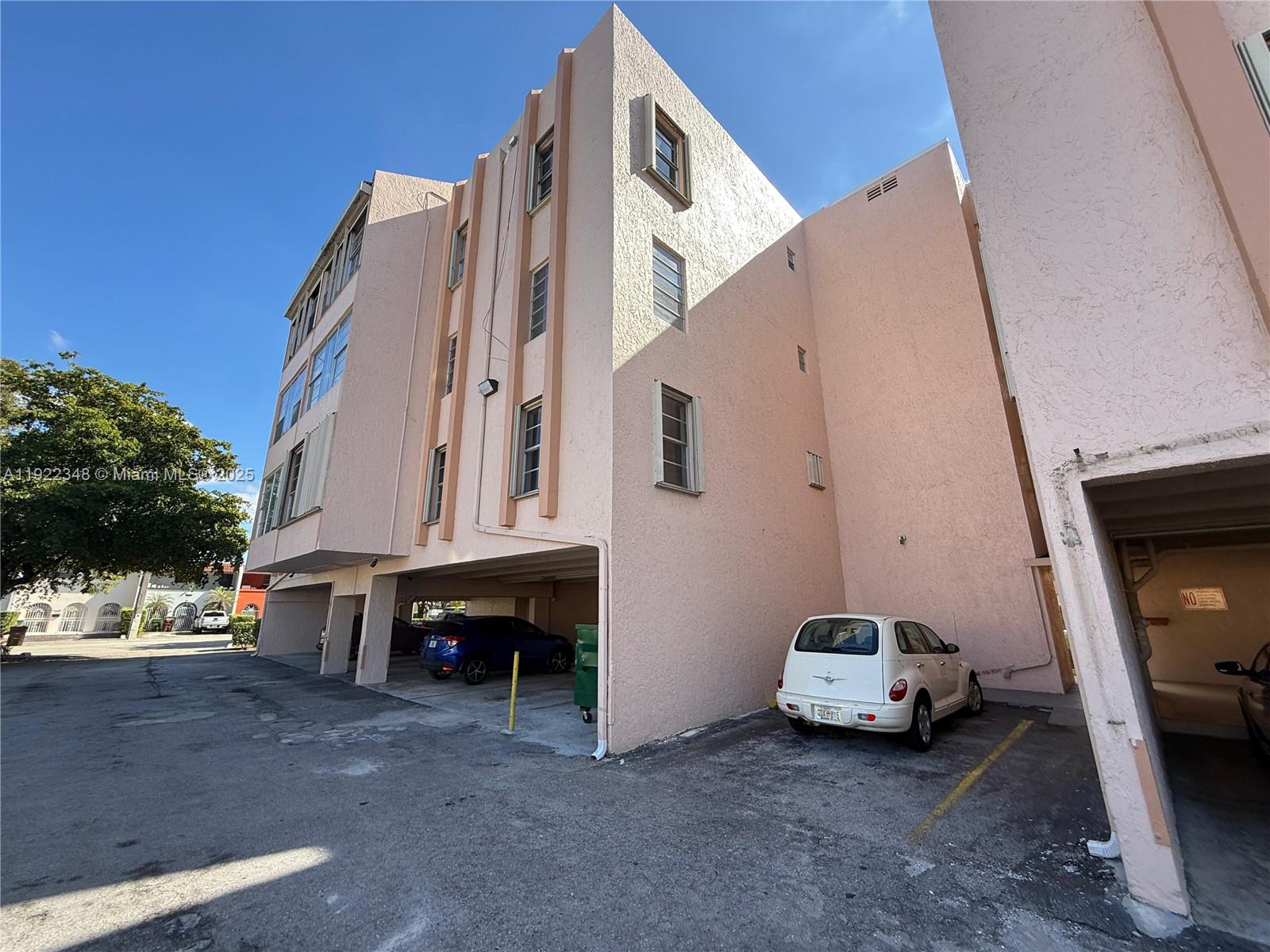 7355 West 4th Avenue, Unit 214 Hialeah, FL 33014 - Photo 15 of 15 a view of a car park in front of house